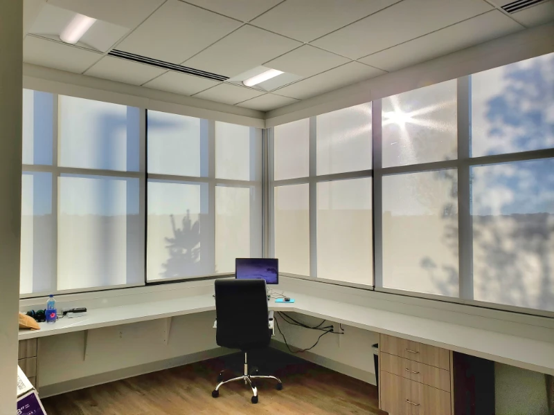 honeycomb shades in the office corner